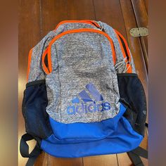 Adidas Backpack, Brand New Without Tags, Colors: Grey, Blue, Orange. Clean Inside, Working Zippers, 2 Big Pockets To Hold Your Items Casual Orange Sports Bag, Functional Orange Backpack For School, Casual Blue Bags, Blue Casual Sports Backpack, Casual Blue Sports Backpack, Blue Sporty Backpack For School, Adidas Backpack, Big Pockets, Grey Blue