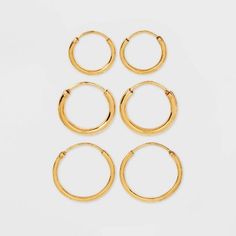 Whether you want to create an understated or noticeable look, the 14K Gold-Plated Trio Hoop Earring Set from A New Day™ will meet all your accessorizing needs. This trio hoop earring set includes three simple sets of hoop earrings in varying sizes. Each piece is designed in a gold tone for easy mixing and matching with your outfits, and boasts a nickel-free construction to suit all types of skin. Add the pieces to your own accessory collection, or gift them to a loved one for their birthday, ann Hoop Earring Set, Types Of Skin, Earring Sets, Golden Earrings, Hoop Earring Sets, Birthday List, Gold Hoops, Christmas Wishlist, Gold Hoop