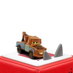 a toy truck with a shark on the back