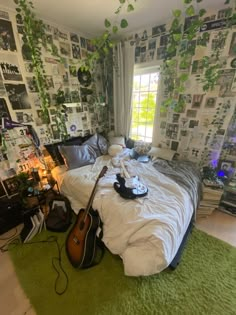 a bedroom with a guitar on the bed