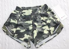 THANK YOU for SUPPORTING SMALL BUSINESS by shopping here at THE ReSTYLE SHOP! LULULEMON 2021 ― Size 4 ― HOTTY HOT LOW RISE 4” Heritage 365 Olive Green Camo Shorts NWT ― #CD97 WOMENS SIZE: 4 STYLE: HOTTY HOT LOW RISE 4” SHORTS FABRIC: 86% Recycled Polyester/14% Elastane (Liner: 89% Polyester/11% Lycra Elastane) COLOR: Heritage 365 Camo Crispin Olive Green FEATURES: Interior brief lining, Left side vertical zipper pocket, From the 2021 season! CONDITION: NEW with tags attached! GUARANTEED AUTHENTI Camo Shorts, Nike Running Shorts, Green Camo, Nike Running, Christmas Wishlist, Running Shorts, Low Rise, Zipper Pocket, Olive Green