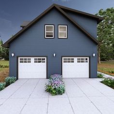 a blue house with two garages and flowers in the front yard