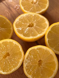 five lemons cut in half on a cutting board