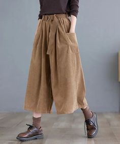 Crafted for the scholarly chic, these pants in brown, green, and khaki epitomize the Dark Academia aesthetic. High-rise with classic pleats, they pair seamlessly with brogues or a cozy sweater. Ideal for vintage aficionados seeking a hint of modern flair. Dark academia aesthetic Two front pockets Loose fits High waist Cotton, corduroy material Belt not included Plus Size Dark Academia, Cottagecore Clothes, Aesthetic Clothing Stores, Cropped Wide Leg Pants, Casual Wide Leg Pants, Winter Pants, Dark Academia Aesthetic, Fall Fabric, Korea Fashion