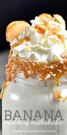 a banana pudding in a jar with whipped cream and caramel drizzle on top