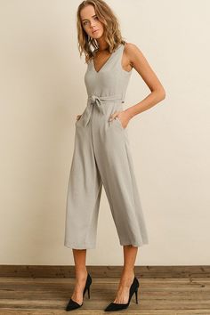 Cropped jumpsuit featuring a plunging v-neckline, wrap-back/tie-front bodice, and a cutout detail at the back Hidden back zipper. Model is 5'8'' and wearing size small Wrap Jumpsuit, Cropped Jumpsuit, The Back, Bodice, Jumpsuit, Zipper, Grey, How To Wear