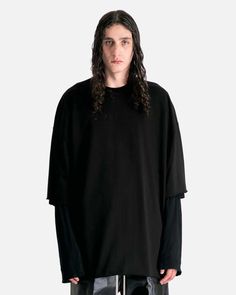 Rick owens tommy t in black. this shirt features a ribbed crewneck signature level shoulder seams dropped shoulder seams 3/4 sleeves raw cut cuffs and hem and a seam running down the center back. Rick Owens Men, Satin Bags, Designer Clothes For Men, Engineered Garments, Black Blazers, Rick Owens, Long Tops, Drop Shoulder, Mens T