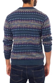 Step out in style, with this chic trendy sweater. Precisely knitted motifs surround this handsome men's sweater from Peru's Fernando Cano. Working in luxurious alpaca wool, he creates a design of intricate geometry in shades of blue and grey with purple accents. Alpaca Dry cleaning recommended Textile softness: Soft -- this item has been made with natural fibers that are soft to the touch Handmade in & fairly traded from Peru Wool Jacquard Knit Crew Neck Cardigan, Blue Wool Sweater With Fair Isle Pattern, Casual Merino Wool Jacquard Knit Sweater, Blue Alpaca Long Sleeve Sweater, Casual Merino Wool Sweater With Fair Isle Pattern, Fall Blue Alpaca Sweater, Blue Long Sleeve Alpaca Sweater, Casual Wool Sweater With Fair Isle Pattern, Trendy Sweater