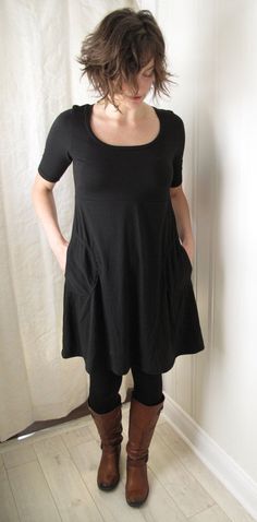 A comfortable, stylish dress, and one of our best sellers. Features a scoop neck, elbow length sleeves, and a smooth Aline skirt that sweeps out from the flattering empire waist, giving a little extra room for your belly and hips. With two side patch pockets. Made out of a silky soft bamboo/cotton/spandex fabric. Looks fantastic on it's own, or layer it over tights and boots. Shown in black. This item is made to order. Please indicate your size and colour choice when you purchase. Allow 3-5 week Solid Scoop Neck Stretch Dress, Solid Color Stretch Dress With Scoop Neck, Stretch Solid Dresses For Everyday Wear, Stretch Solid Dress For Everyday Wear, Casual Scoop Neck Everyday Dress, Everyday Stretch Solid Dresses, Everyday Solid Stretch Dresses, Solid Color Short Sleeve Everyday Dresses, Everyday Solid Color Dress With Short Sleeves