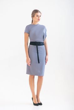 "A beautiful gray dress is featuring an asymmetrical design, pencil silhouette, and a midi length. - fitted pencil silhouette - asymmetrical blouson bodice - short cap sleeves - midi (knee length) skirt - concealed side seam closure - velvet belt included (you may choose red or black) Fiber: 55% viscose, 40% polyester, 5% elastane Color: gray For size S: length- 40,5\" (101 cm) Our model wears size S (US 8) and is 171cm/5'6\" tall. You may feel free choosing the size. Just send us your measureme Elegant Asymmetrical Midi Dress For Work, Fitted Pencil Skirt Bodycon Dress For Work, Chic Asymmetrical Midi Dress For Semi-formal Occasions, Bodycon Knee-length Midi Dress For Work, Knee-length Bodycon Midi Dress For Work, Fitted Sleek Sheath Midi Dress, Sleek Fitted Sheath Midi Dress, Fitted Office Lady Bodycon Dress For Evening, Fitted Bodycon Office Dress For Evening