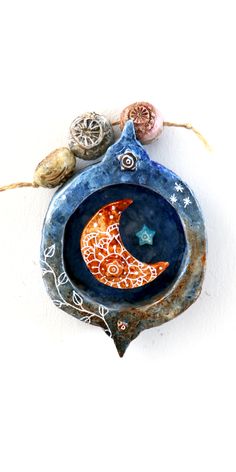 a blue plate with two shells on top of it and a star in the middle