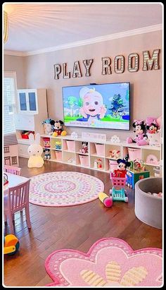 a play room with mickey mouse rugs and toys