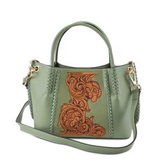 L'Artiste Style: HB-Mare: Western and vintage-inspired leather whipstitched edges, strap ends, and central frame surround an authentic hand-tooled floral saddle design on this super cute and roomy 3-compartment hand-held or cross-bodied tote.   Featuring an adjustable leather removable shoulder strap with double keeper Saddle Design, Spring Step Shoes, Western Women, Hand Painted Leather, Shoes Spring, Size Chart For Kids, Painting Leather, Bright Gold, Artist Style