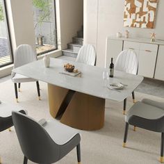 a dining room table with chairs around it