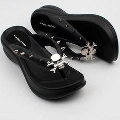 Go to the party with our Black Wedge Heel Flip Flops adorned with bewitching Halloween pins. These unique flip flops blend comfort and chic, featuring a sleek black design that effortlessly complements any outfit. The wedge heel adds a touch of elegance while ensuring all-day comfort. Plus, our exclusive Halloween pins add a playful twist, allowing you to customize your look for the season's festivities. Step into the spirit of Halloween fashion with these versatile and eye-catching wedge heel s Heel Flip Flops, Alt Shoes, Halloween Skulls, Goth Shoes, Heeled Flip Flops, Dr Shoes, Halloween Pins, Wedge Flip Flops, Girly Shoes