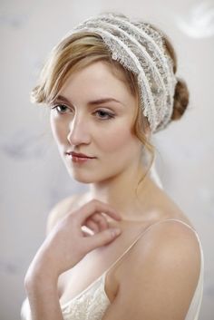 a woman in a white dress wearing a headband