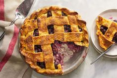 two plates with pies on them sitting on a table