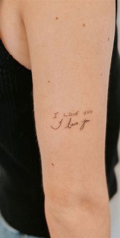 a woman with a tattoo on her arm that says i love you, i know you