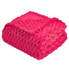 a bright pink blanket folded on top of each other