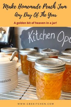 jars filled with honey sitting on top of a metal rack next to a sign that says make homemade peach jam any day of the year