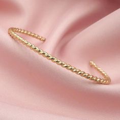 Our Twisted Cuff adds the perfect amount of texture and shine to your bracelet stack. We love it worn all alone for a minimalist look or stacked with your other favorite bracelets for an enviable arm stack. DETAILS- 14kt gold filled- Slips on/ off- Adjustable for a great fit****SIZES****X Small= wrists measuring 5 to 5.5 inchesSmall = wrists measuring 5.5 to 6.5 inchesMedium= wrists measuring 6.5 to 7.5 inchesLarge = wrists measuring 7.5 inches to 8.5 inchesX Large= wrists measuring 8.5 to 9.5 i Arm Stack, Deer Jewelry, Gold Cuff Bracelet, Gold Bracelet Cuff, All Alone, Hammered Gold, Gold Cuffs, Bracelet Stack, 14kt Gold