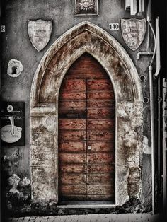 an old building with a large wooden door