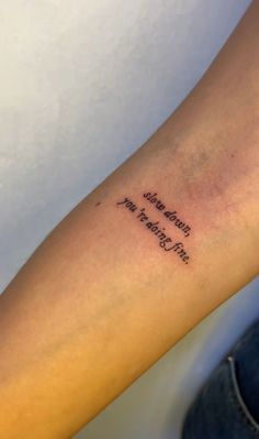 a person with a tattoo on their arm that says, i'm not afraid to see