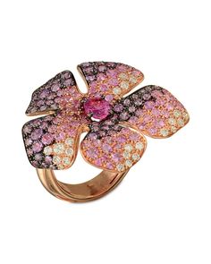 A beautiful flower designed fashion ring with a colorful set of pink and purple sapphires.The ring has diamonds that weigh 0.40 carats.The pink and purple sapphire stones are 4.18 CTW. Diamond Flower Ring, Sapphire Stones, Beautiful Flower Designs, Pink Tourmaline Ring, Rainbow Jewelry, Purple Jewelry, Purple Sapphire, Pink Bling, Wire Necklace