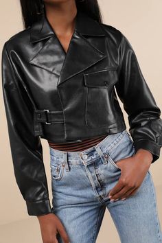 The most stylish baddies this season will be hitting the town in the Shaci Amat Black Vegan Leather Cropped Moto Jacket! Smooth vegan leather shapes this chic lil' jacket that features a collared neckline with notched lapels and long sleeves with snap button epaulets and button cuffs. The ultra-cropped bodice has a wide-cut silhouette that secures with a buttoning strap at one side, while a single, functional button patch pocket accents the other side. Fit: This garment fits true to size. Length Chic Fall Leather Jacket With Lapel Collar, Fitted Collared Biker Jacket For Winter, Edgy Leather Cropped Jacket For Spring, Leather Cropped Jacket For Spring Night Out, Black Cropped Jacket With Lapel Collar For Fall, Chic Cropped Fall Outerwear, Modern Cropped Jacket With Lapel Collar For Fall, Single Breasted Collared Cropped Jacket For Fall, Spring Single Breasted Long Sleeve Biker Jacket