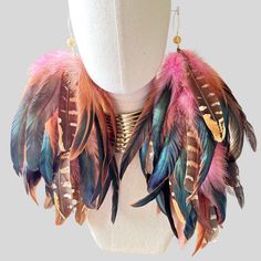 Pink Schlappen and Venery Pheasant Wing Feathers. These Boho dangle earrings are handmade in the USA with natural feathers. These Boho Stylish, Chic, and Elegant Feather Dangle Earrings are a statement piece for all Unique Women. The feather earrings are made with Natural Pink Schlappen and Venery Pheasant Wing Feather Earring. These Dangle Earrings are connected on a chain. The Feathers are approximately 8”-12” long from top to bottom. All our Feathers are treated under high-temperature sterili Wing Feathers, Unique Women, Earring Organizer, Bleach Dye, Chic And Elegant, Pink Boho, Pheasant, Feather Earrings, Colorful Boho