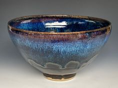 a blue and brown bowl sitting on top of a table