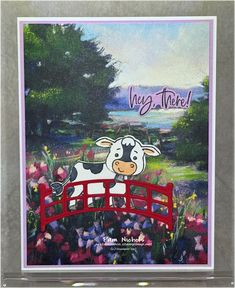 a card with a painting of a cow on a bridge and flowers in the background