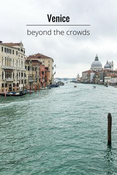 the water in venice, italy is blue and green with buildings along it's sides