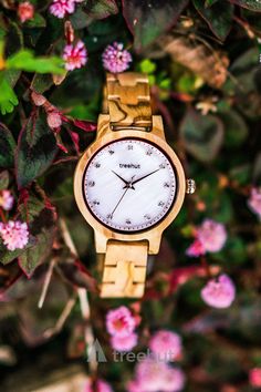 The iridescent nature of the this watch makes it undoubtedly unique. The Pearl Olive Frost women's watch features an iridescent white mother of pearl dial accented with white diamonds as numbers framed with an elegantly minimal case and band made from all olive walnut wood. #olivewalnut #woodwatch #engravedwatch #watchformom #watchforher #treehut #pearlcollection Rose Gold Band, Personalized Gifts For Her, Mother Pearl