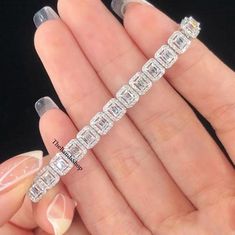 Tennis Bracelet, 18 TCW Emerald Cut Moissanite Bracelet, Colorless Halo Diamond Women's Bracelet, 18k White Gold Bracelet, Wedding Bracelet    ✹✹𝐖𝐞𝐥𝐜𝐨𝐦𝐞 𝐭𝐨 𝑻𝒉𝒆𝑩𝒂𝒏𝒅𝒔𝑺𝒉𝒐𝒑✹✹ ★ 𝑺𝒕𝒐𝒏𝒆𝒔 𝑫𝒆𝒕𝒂𝒊𝒍𝒔 ★ ● Stone Shape:- Emerald Cut & Round Cut ● Stone Type:- Simulated Diamond, Moissanite ● Stone Size:- 6x4 mm & 1.30 mm  ● Color:- DEF ● Clarity: VVS-VS ● Cut Grade: Excellent ● Making Process: Handmade - Crafted by our experienced team ★ 𝑰𝒕𝒆𝒎 𝑫𝒆𝒕𝒂𝒊𝒍𝒔:- ☛ Metal Purity: Solid Gold (10KT, 14KT, 18KT); Silver(925 Sterling, 935 Argentium), 950 Platinum ☛ Metal Tone: Yellow, White, Rose ☛ Stamp/Hallmark: Yes ★ 𝑪𝒖𝒔𝒕𝒐𝒎𝒊𝒛𝒂𝒕𝒊𝒐𝒏:- ☛ Customized Design Jewelry. ☛ All cuts which you dream to make with moissanite. ☛ Updating every step of your ordered jewelry(Loo White Moissanite Bracelets Fine Jewelry, White Moissanite Bracelet Fine Jewelry, Silver Emerald Cut Diamond Bracelet For Wedding, Wedding Silver Emerald Cut Diamond Bracelet, Emerald Cut Diamond Tennis Bracelet For Wedding, White Diamond Baguette Cut Bracelet, White Moissanite Tennis Bracelet As Gift, White Moissanite Fine Jewelry Tennis Bracelet, Luxury White Moissanite Bracelets