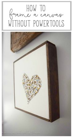 a wooden frame with a heart drawn on it and the words how to frame a canvas without