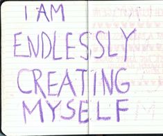 an open notebook with writing on it that says i am endlessly creating my self