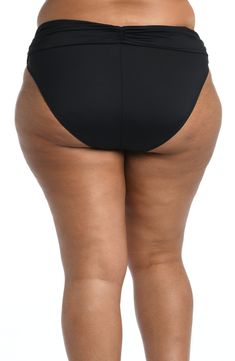 Our hipster bikini bottoms instantly smooth and slim with an eye-catching ruched band that conceals worry areas. The hipster cut flatters your figure in front with discreet coverage in back that won't take away from your curves. [split] Details Hipster bikini bottoms Fold-over ruched banding Moderate coverage in the back Fabric 83% Nylon, 17% Elastane Solid Color Stretch Tankini With Smoothing Detail, Solid Color Stretch Tankini With Smoothing, Solid Smoothing Stretch Tankini, Solid Color Smoothing Stretch Tankini, Solid Shaping Swimwear With Smoothing Details, Stretch Tankini With Wide Waistband Brief, Smoothing Shaping Swimwear In Solid Color, Solid Color Smoothing Shaping Swimwear, Smoothing And Shaping Solid Color Swimwear