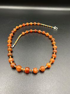 The beautiful carnelian mala necklace along with some small beads of carnelian as spacers The age of this beads are more than 2000 years old carnelian and old agate was used in ancient times in prayer mala and in jewelry necklaces we provide fast and free shipping service world wide Artisan Single Strand Orange Beaded Necklace, Hand-strung Orange Jewelry With Round Beads, Orange Hand-strung Jewelry With Round Beads, Bohemian Orange Single Strand Beads, Artisan Orange Beaded Necklaces, Artisan Orange Round Beaded Necklaces, Hand-strung Orange Necklace, Orange Single Strand Beaded Necklace With Round Beads, Artisan Orange Round Beaded Necklace