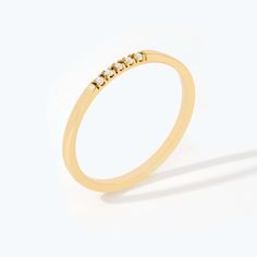 Step into elegance with this Diamond Five Stone Line Ring, beautifully set in 14K solid gold. Ideal as a stacking ring for women or a stand-alone piece, it sparkles with real diamonds. A perfect gift for her, this dainty ring showcases timeless style and intricate detailing, making it a must-have piece in every jewelry collection. 14k solid gold handcrafted pieces 100% ethical sourced jewelry Material: 14k Solid Gold Diamond Quality:Carat Weight: 0.05 ctColor: F-GClarity: VS2Cut: Excellent Band Diamond Stacking Rings, Gold Diamond Jewelry, Sparkling Rings, Dainty Ring, Perfect Gift For Her, Real Diamonds, Real Gold, Stacking Rings, Gold Diamond