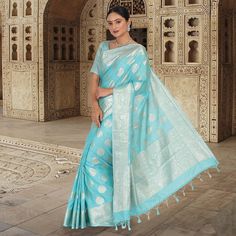 If you're looking for a saree that exudes elegance and refinement, look no further than the Monica Silk Banarasi saree. This beautiful piece is crafted from traditional banarasi silk, and features a stunning silver border. The blouse is stitched and ready to wear, making this saree a perfect option for any special occasion. Whether you're attending a wedding or a formal event, the Monica Silk Banarasi saree is sure to make you look and feel your best. Fall and Pico - Done Blouse - Stitched Blue Banarasi Saree Look, Sky Blue Banarasi Saree, Banarasi Saree Look, Banarasi Saree Look For Wedding, Saree Look For Wedding, Blue Banarasi Saree, Silk Banarasi Saree, Banarasi Saree, Saree Look