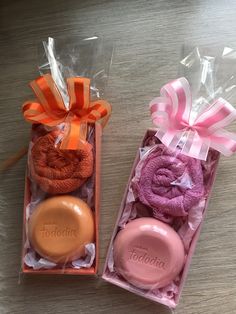 two pink and orange soaps in a box with ribbon on the top one is for someone's birthday