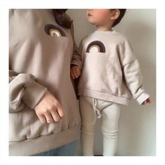 Our favourite mommy & me outfit. Match with the same colour or mix and match between beige and chestnut. Mommy Sweater is size Small Fabric & Care: -Cotton, Fleece detail on rainbow -Machine wash on delicate Embroidered Leather Jacket, Single Dress, Mother Daughter Outfits, Kids Jumpers, Cozy Tops, Print Swimwear, Cotton Leggings, Kids Swimwear, Mothers Day Shirts