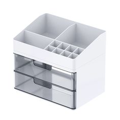 an open drawer with compartments on the bottom and two drawers in each drawer, all white