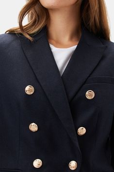 A sleek, tailored blazer with notched lapels, flap pockets, and gold-toned buttons adds distinctive style to a classic wardrobe. Double-breasted blazer with notched lapel, welt pockets, and gold buttons on front and cuffs Slim fit 70% RWS Virgin Wool, 25% Polyamide, 5% Recycled Cashmere woven in Italy 100% Recycled Polyester lining 27 1/2" in length Runs narrow through the sleeve. Size up for a roomier fit Ethically Made in China Recycled Cashmere, Classic Wardrobe, Tailored Blazer, Breasted Blazer, Double Breasted Blazer, Dark Navy Blue, Navy Blue Color, Tailored Jacket, Wool Blazer