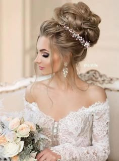 a woman sitting on a couch with flowers in her hair and wearing a wedding dress