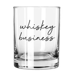 a whiskey glass with the words whiskey business written on it in black ink against a white background