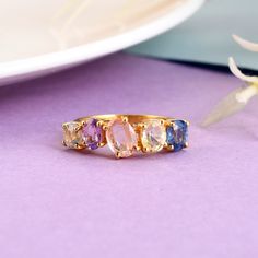 Make a splash with this beautiful prong set multi sapphire gemstone ring in 925 silver and yellow gold rhodium plated (nikle free). all are products are handmade,absolutely new and unworn . ѻ Gemstone : Natural multi colour sapphires  ѻ Metal : Sterling Silver with yellow gold rhodium plating  ѻ Gemstone Size : multiple                               ѻ Current ring size Available : US 7 ѻ Gemstone Cut : full cut multi shapes  All of our jewelry are made with handpicked semiprecious stones and gemstones.  Due to the nature of these semiprecious stones a slight variation in colors may be noticed between the pictures and the real piece. Although we guarantee that this is barely noticeable.  Real Gemstones and semiprecious stones naturally consists of inclusions.  In other words these stones/mi Fine Jewelry Multi-stone Topaz Rings, Fine Jewelry Topaz Multi-stone Rings, Yellow Gold Crystal Ring With Stone Setting, Multi-stone Topaz Promise Ring, Fine Jewelry Hallmarked Sapphire Open Ring, Cubic Zirconia Sapphire Open Ring, Hallmarked Sapphire Open Ring In Fine Jewelry Style, Hallmarked Open Sapphire Ring Fine Jewelry, Gold Multi-stone Sapphire Open Ring