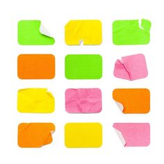 several different colored pieces of paper with torn edges