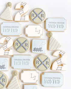 some cookies are arranged in the shape of flags and pennants with names on them